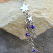 Piercing industriel � cascade d'�toiles en pendentif