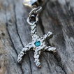 Piercing nombril étoile de mer à strass bleu