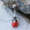 Piercing nombril à griffe de dragon et sphère rouge