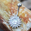 Piercing nombril soleil �blouissant de strass et �cailles