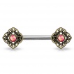Piercing téton à fleurs tribales avec Opales