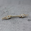 Piercing téton doré éclairs strass