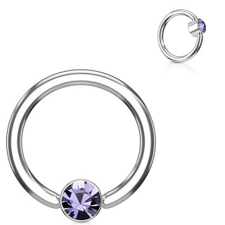 Anneau � cylindre captif serti d'un cristal violet tanzanite