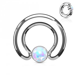 Anneau �carteur � cylindre captif serti d'une opale blanche