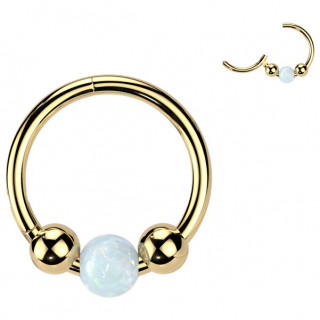 Anneau Titane dor� � trio de perles dont une d'Opale