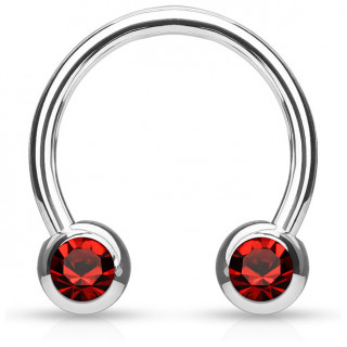 Piercing fer � cheval en acier serti deux cristaux rouges
