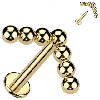 Piercing labret Titane dor� � chevron (fl�che) de 7 perles asym�tiques (filetage interne)